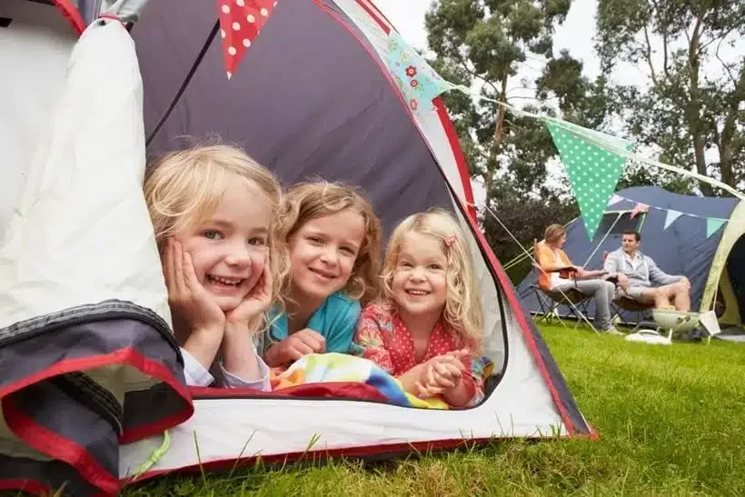 Camping solar setup with tent and portable panels